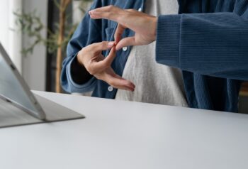Person using sign language during video call on ta 2026 07 10 23 58 47 utc 1440x700